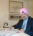 Photo of KP working at his desk